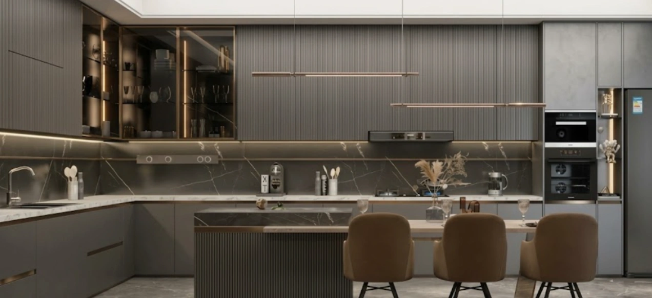 Luxury modular kitchen with island, fluted grey cabinetry, brass handles and integrated appliances
